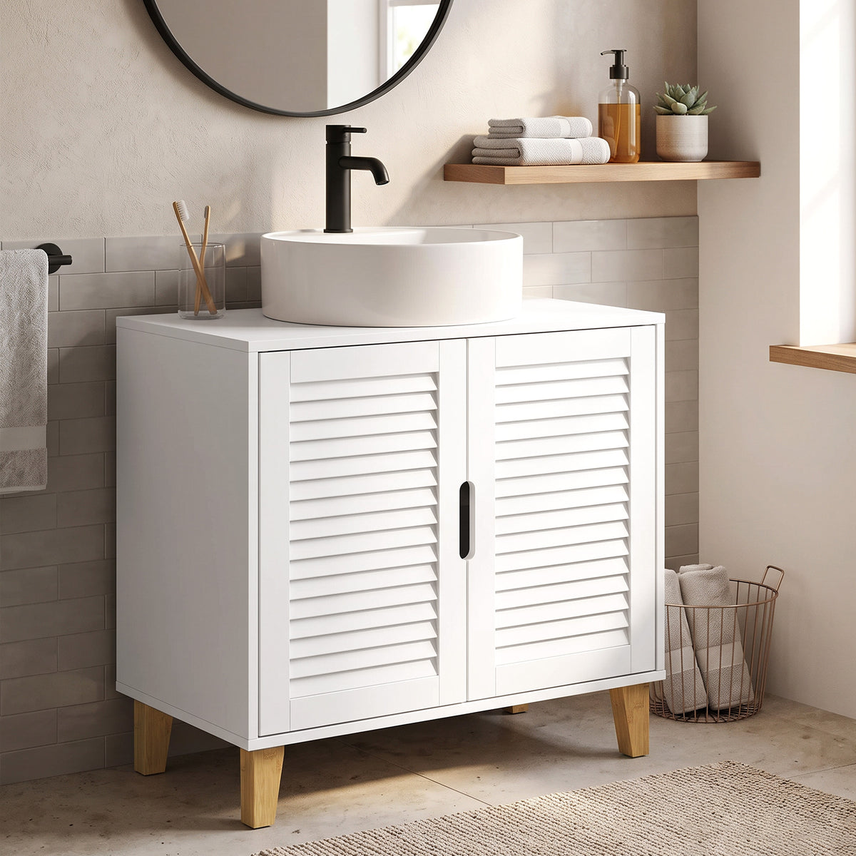 White bathroom under-sink cabinet with louvered doors and integrated handle, shown near sink