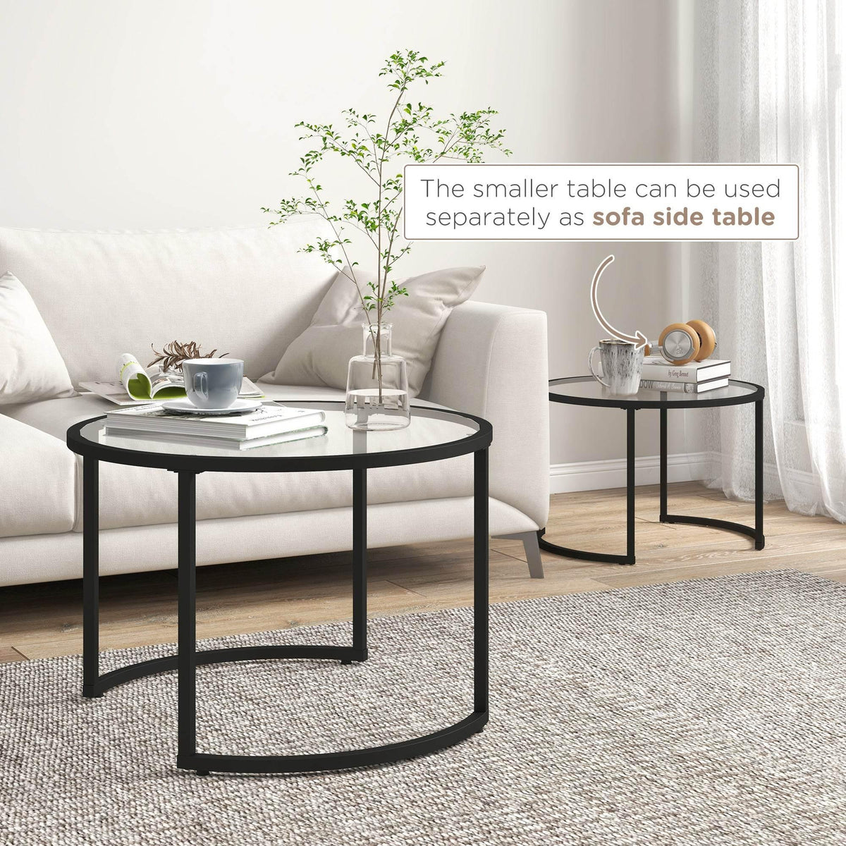 Black round glass coffee tables set of 2, smaller table beside larger