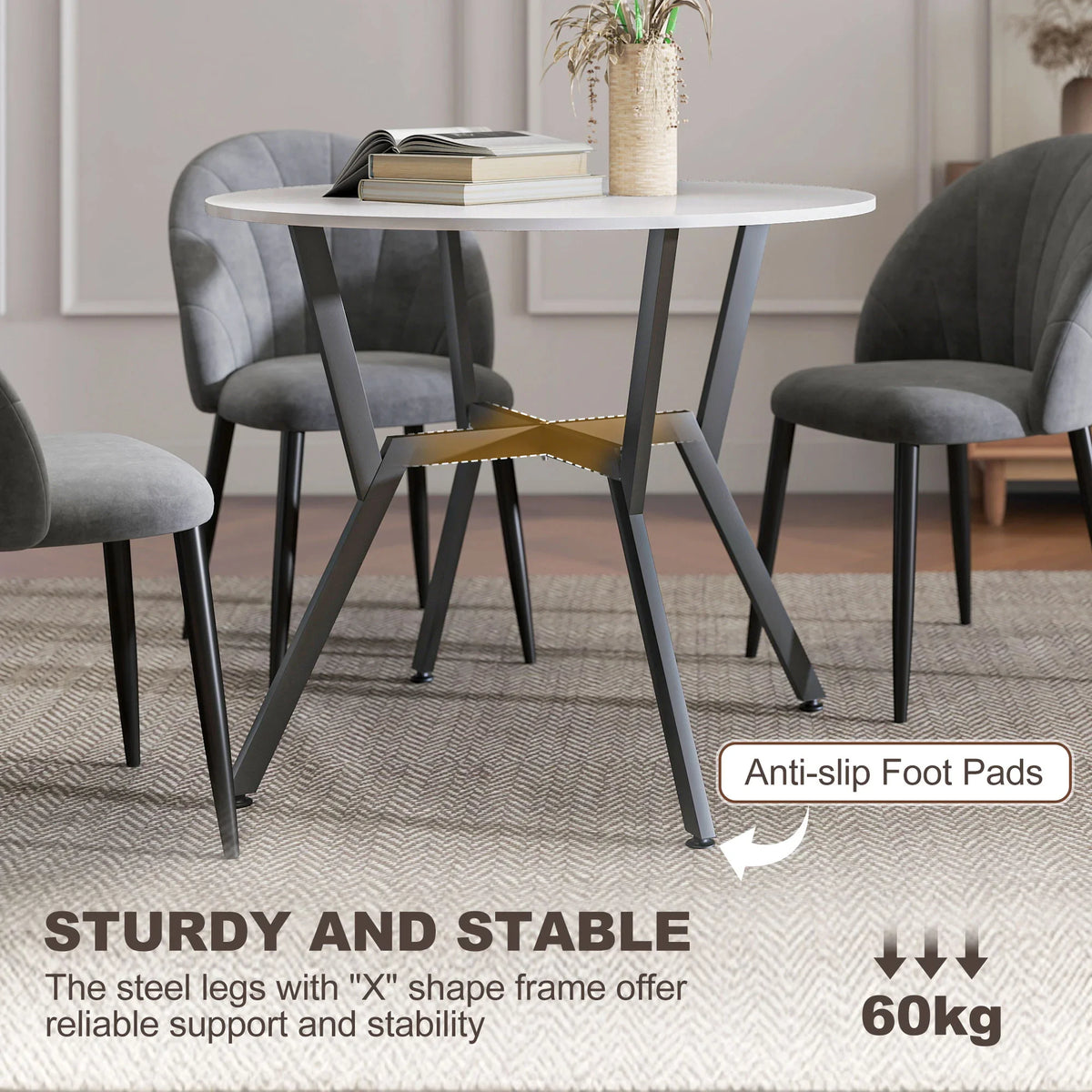 Round white dining table with black metal legs and visible anti-slip foot pads