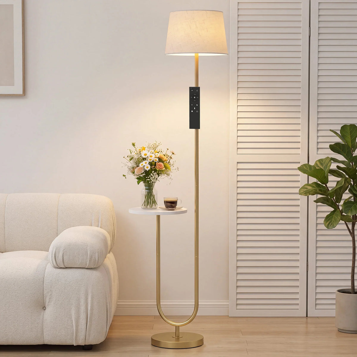 Dimmable floor lamp with linen shade, brass stand, and small side shelf
