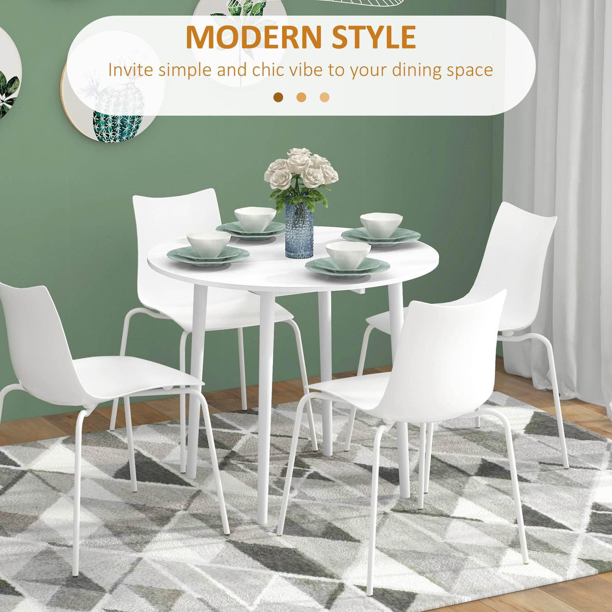 White round drop-leaf dining table with four white chairs in a modern style
