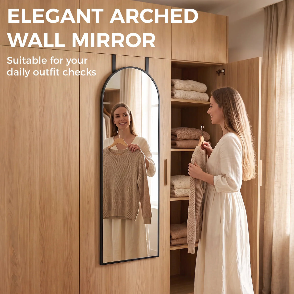 Arched wall mirror with black frame on a closet door for full-body checking