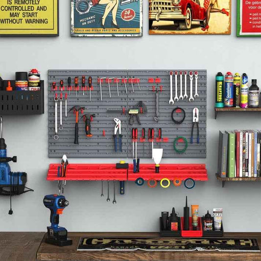 Gray pegboard tool organizer with red shelf, holding wrenches, screwdrivers, and pliers in a garage workshop
