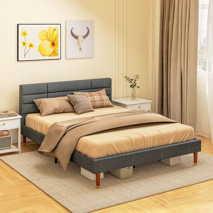 Modern gray upholstered bed frame with storage, styled in cozy bedroom with nightstands and artwork
