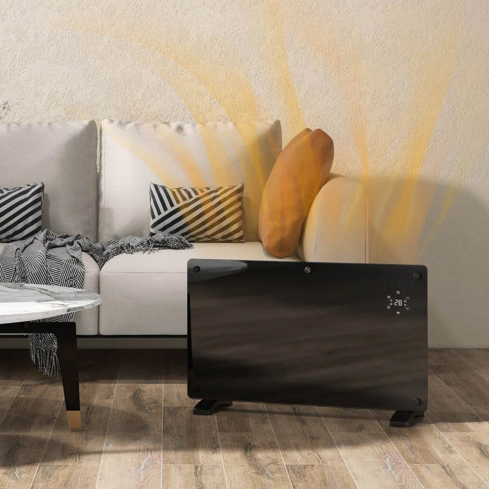 Black digital panel heater warming cozy living room with sofa and coffee table