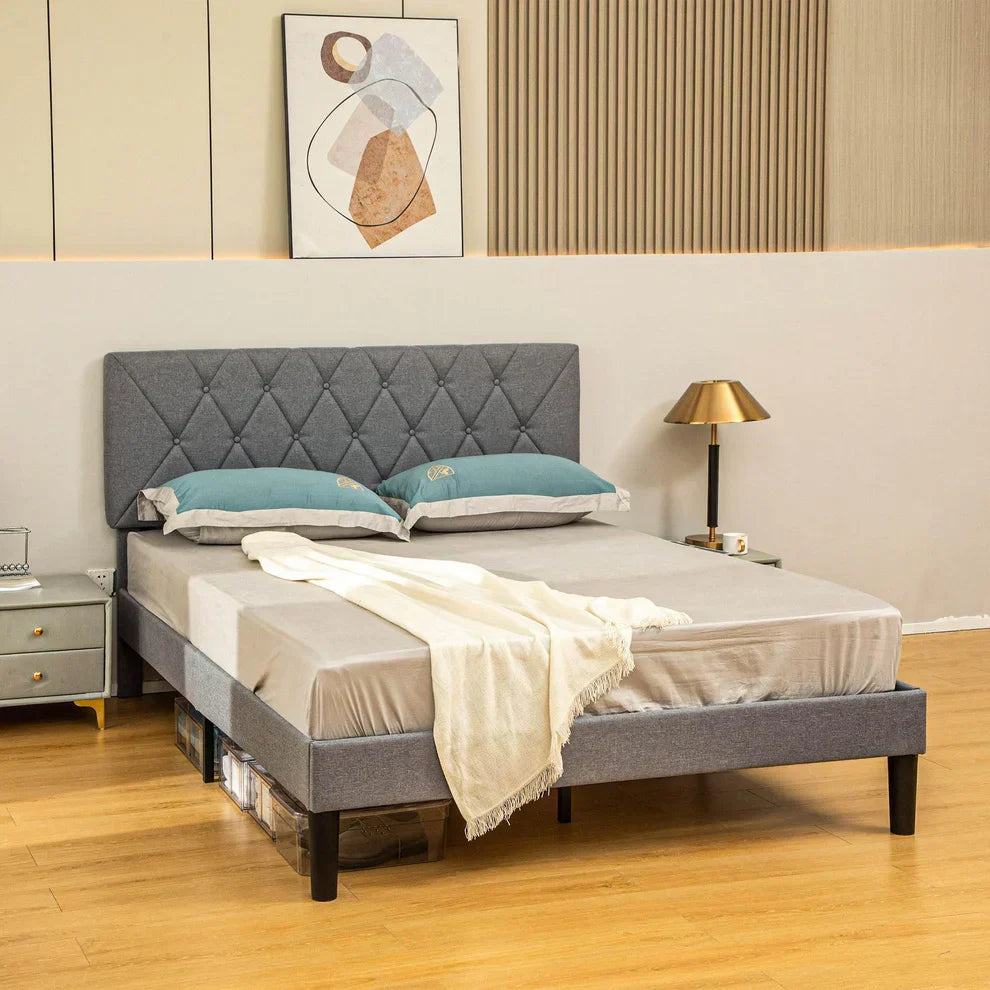 Modern grey upholstered bed frame with blue pillows in a stylish bedroom, ALL4U home furniture