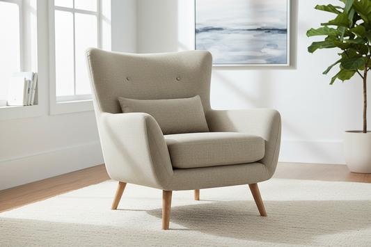 Modern beige armchair with wooden legs in a bright living room setting
