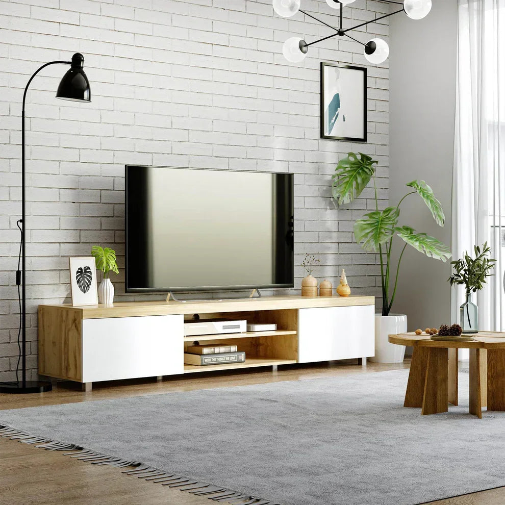 Modern TV stand with white and wood finish in stylish living room with plants and rug