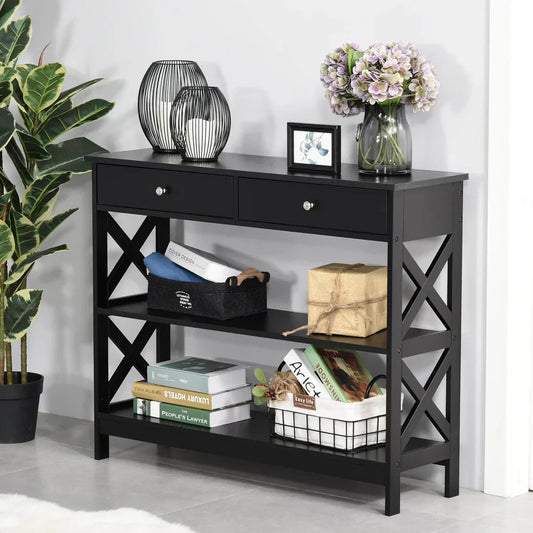 Black console table with drawers and shelves, decorated with books, flowers, and wire baskets