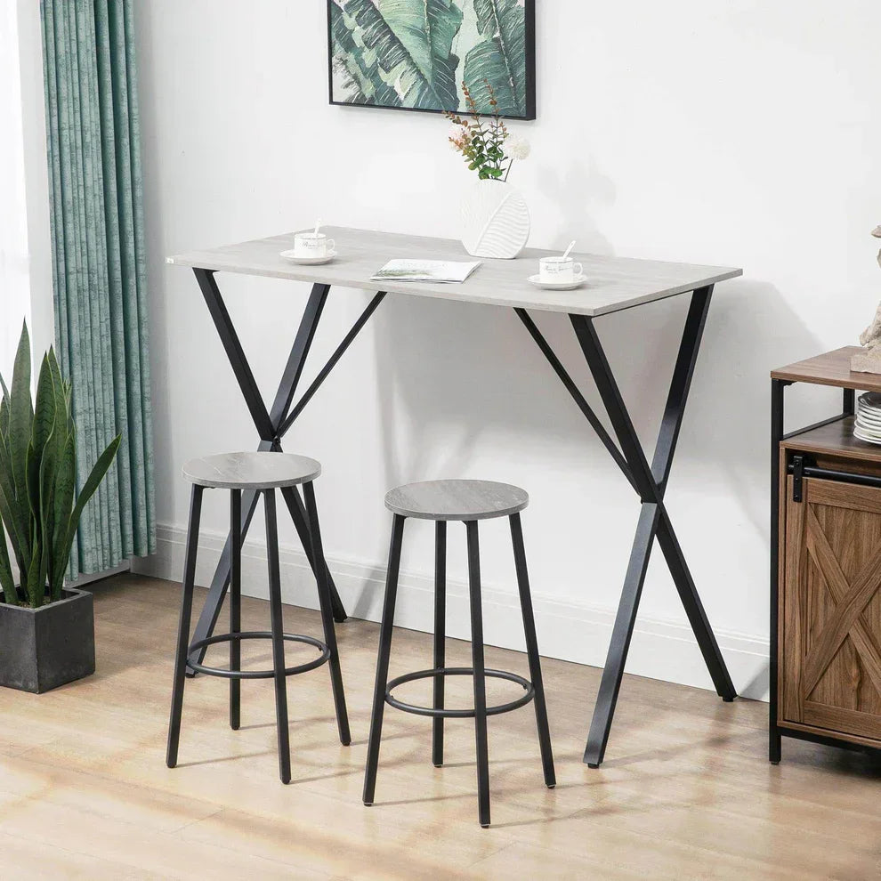 Modern grey bar table with black metal legs and matching stools for home or kitchen use