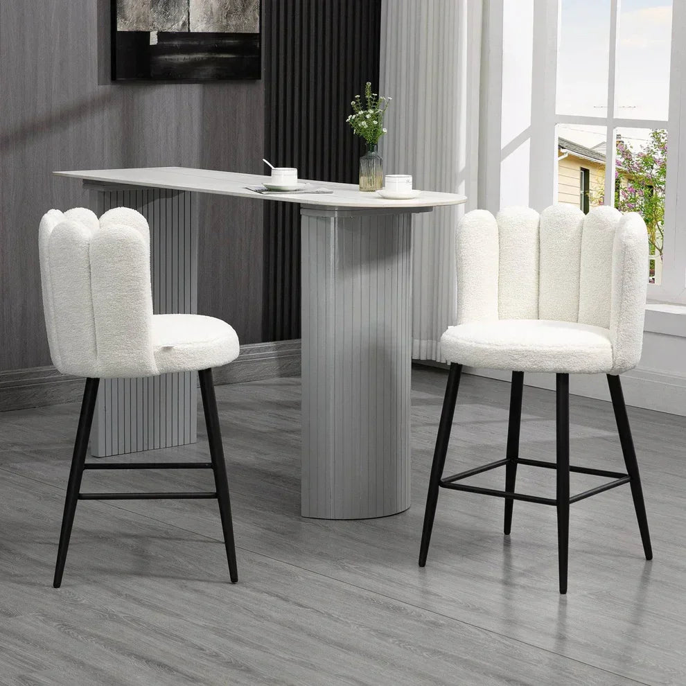White fluffy bar stools with black legs, modern high-top table, home dining setup