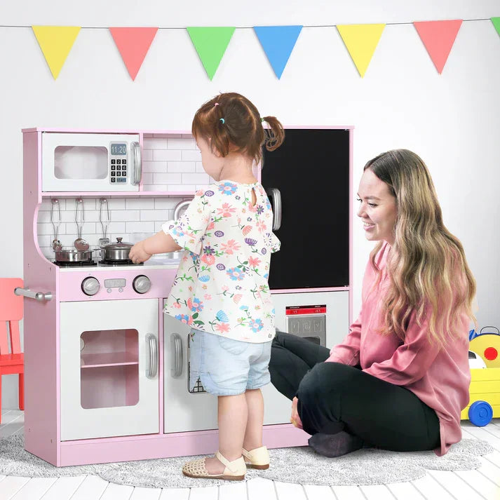 Pink wooden play kitchen set with microwave, oven, and fridge for kids, perfect for imaginative play at home