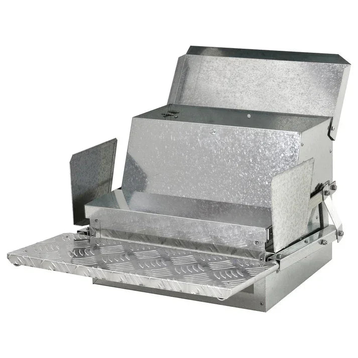 Galvanized metal feed trough with hinged lid and textured ramp for livestock feeding