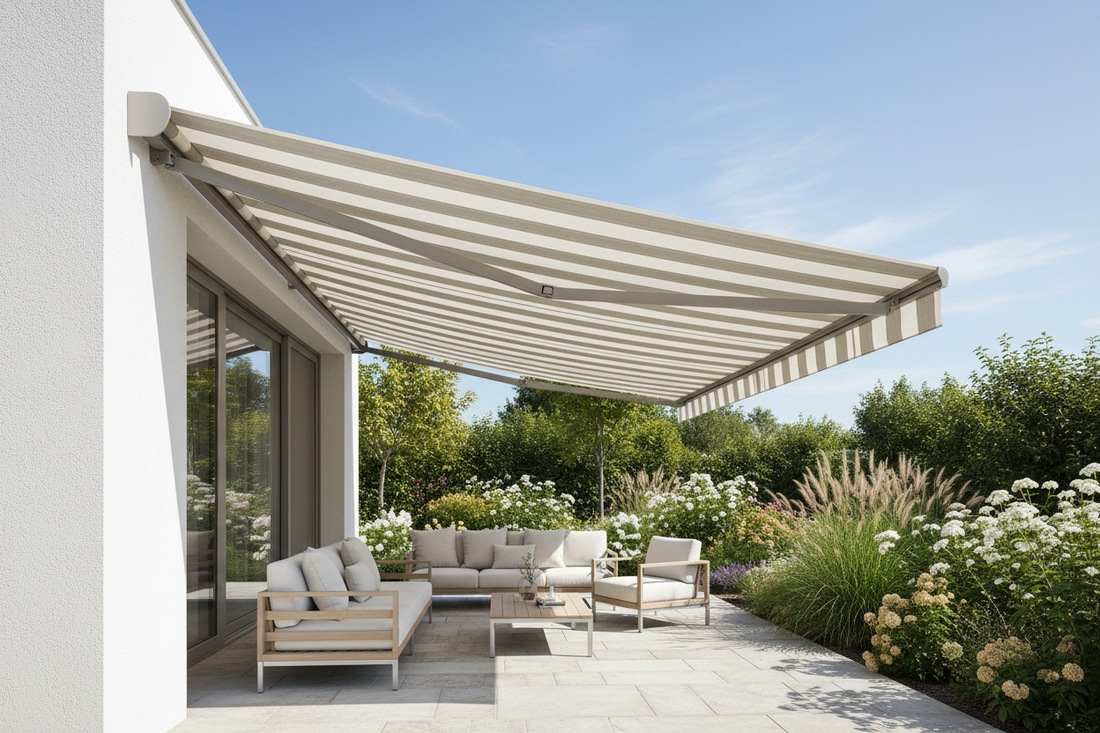 Striped patio awning shading outdoor sofa set on tiled terrace with garden backdrop