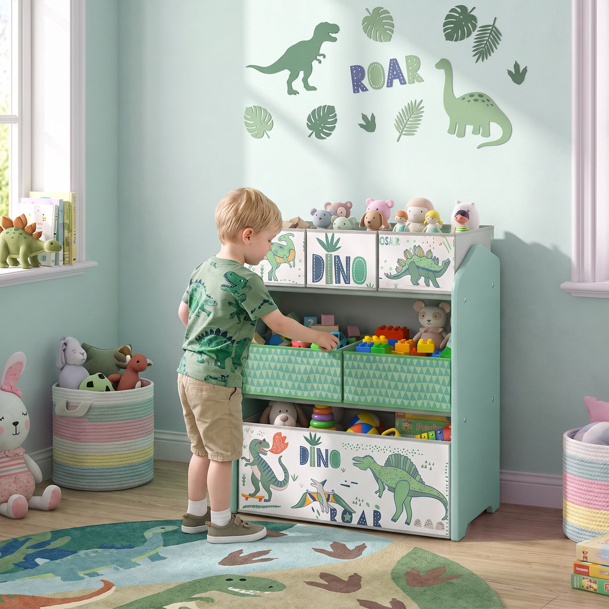 Light green toy storage rack with open fabric drawers and dinosaur prints, full view