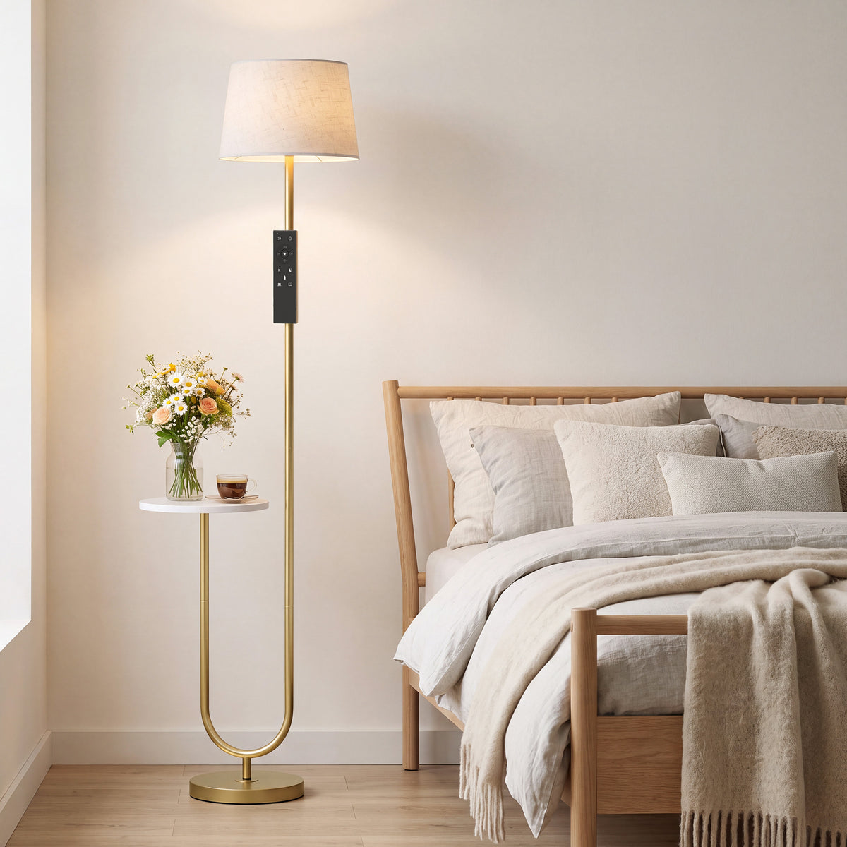Dimmable floor lamp with linen shade and built-in side shelf on a brass U-shaped stand