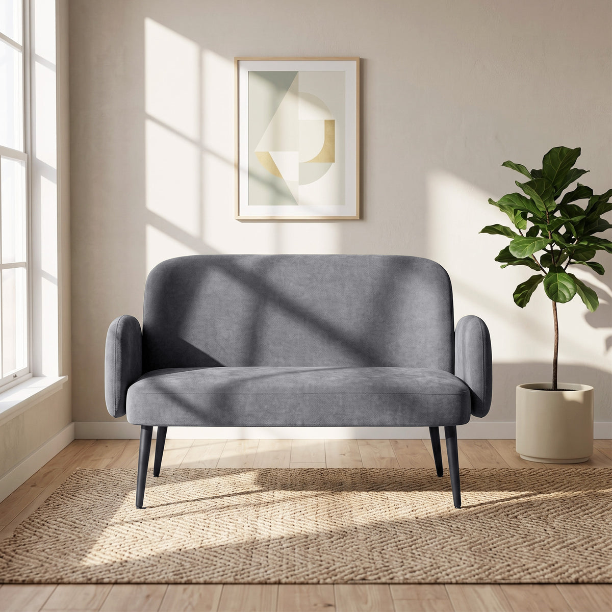 Light grey velvet loveseat sofa with low back, rounded arms, and black legs