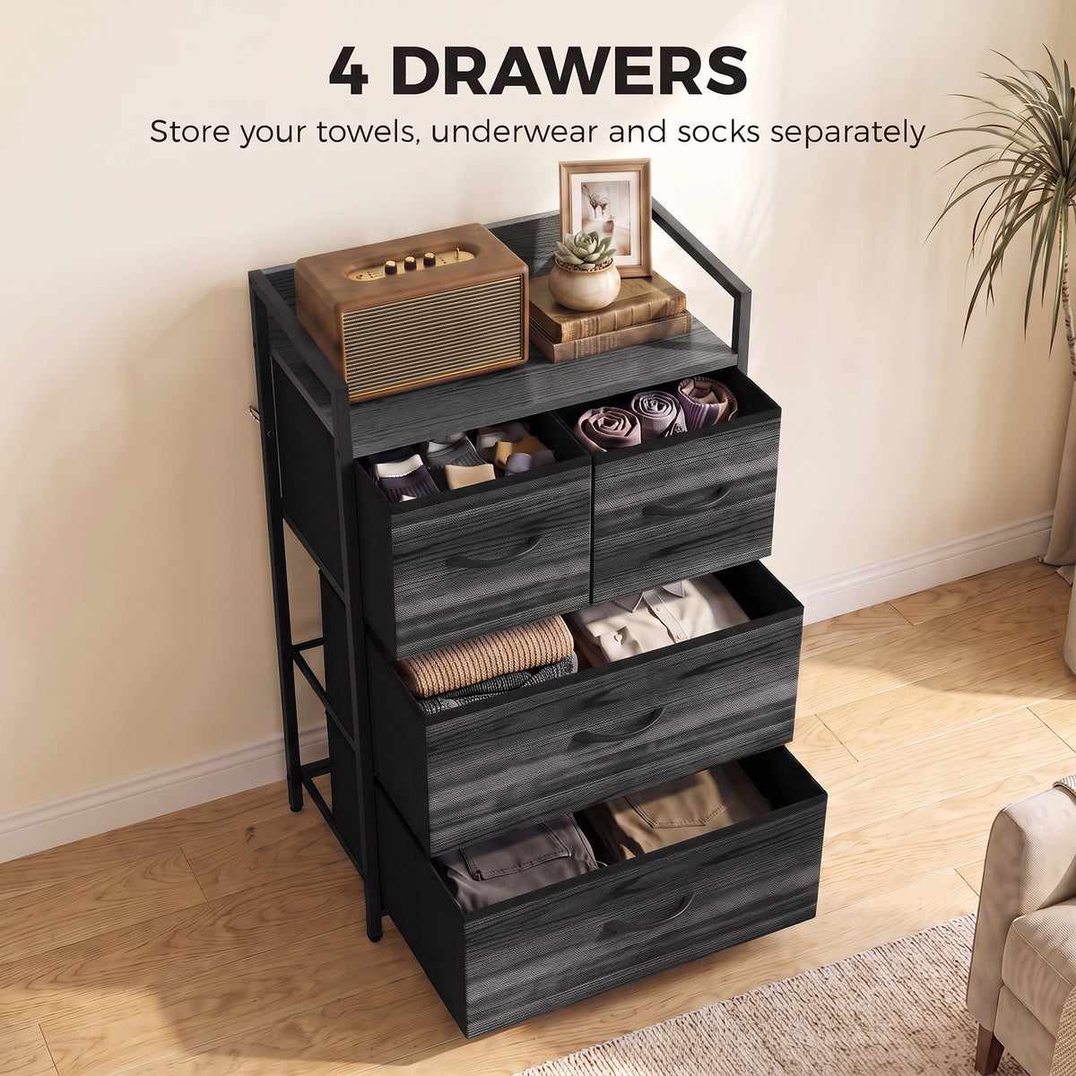 Black four-drawer storage cabinet with drawers open for clothing and linens