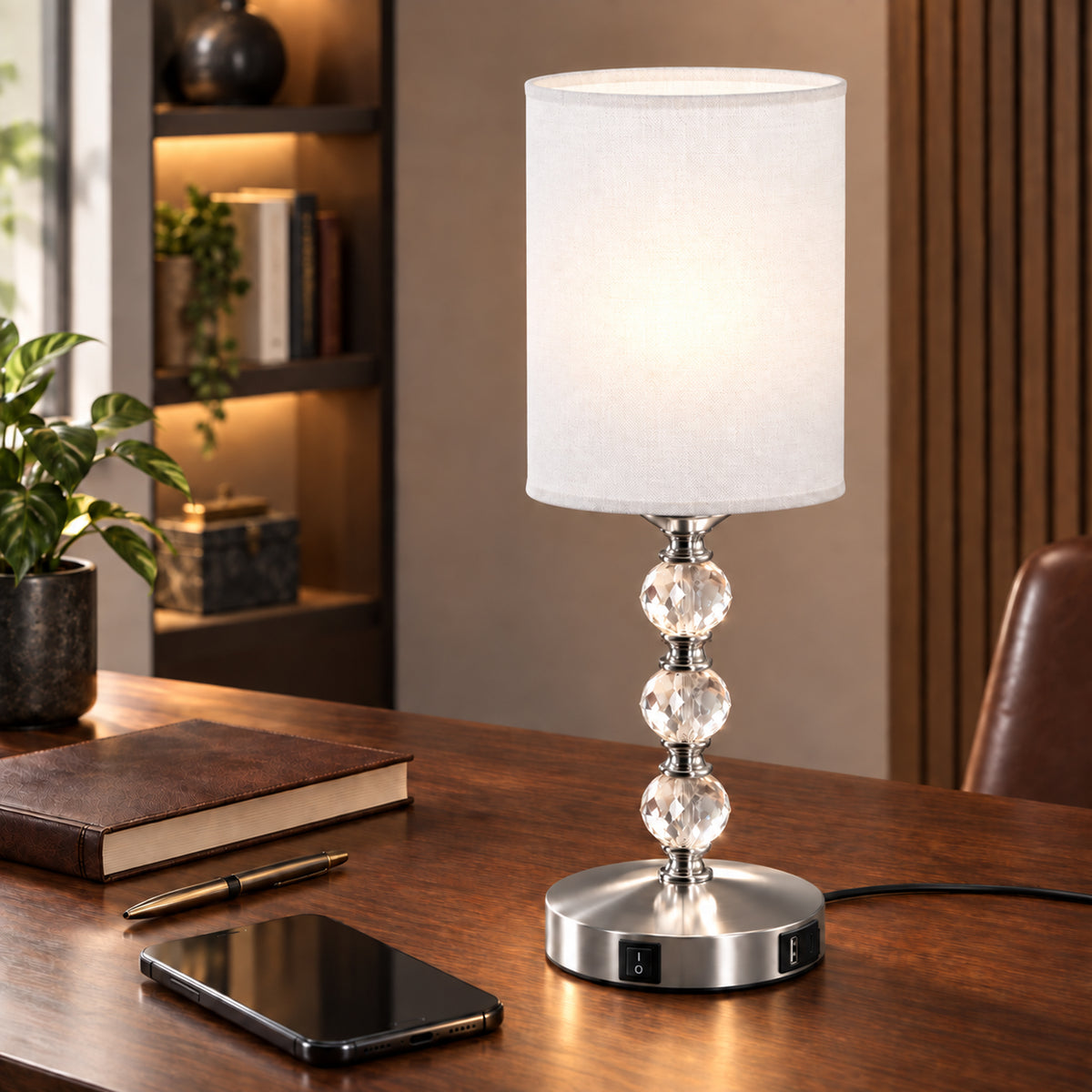 Crystal bedside table lamp with white fabric shade and round metal base with switch