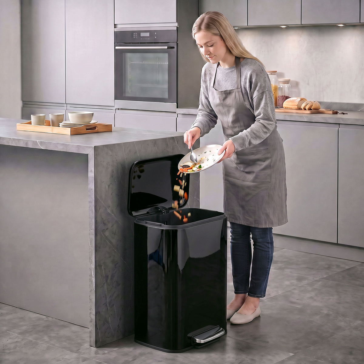 Black kitchen pedal bin with open lid and removable inner bucket