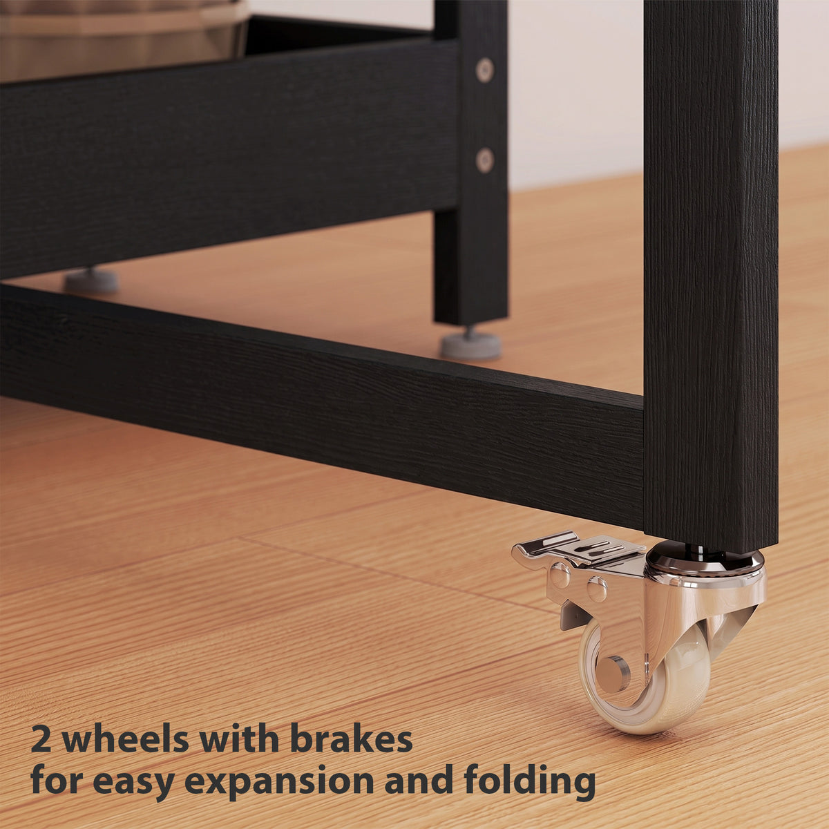 Black dining table on wheels with brakes, black metal frame