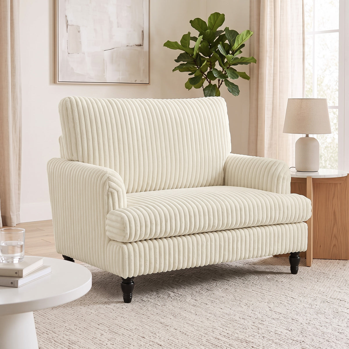 Cream corduroy single sofa armchair with ribbed vertical stripes and padded arms