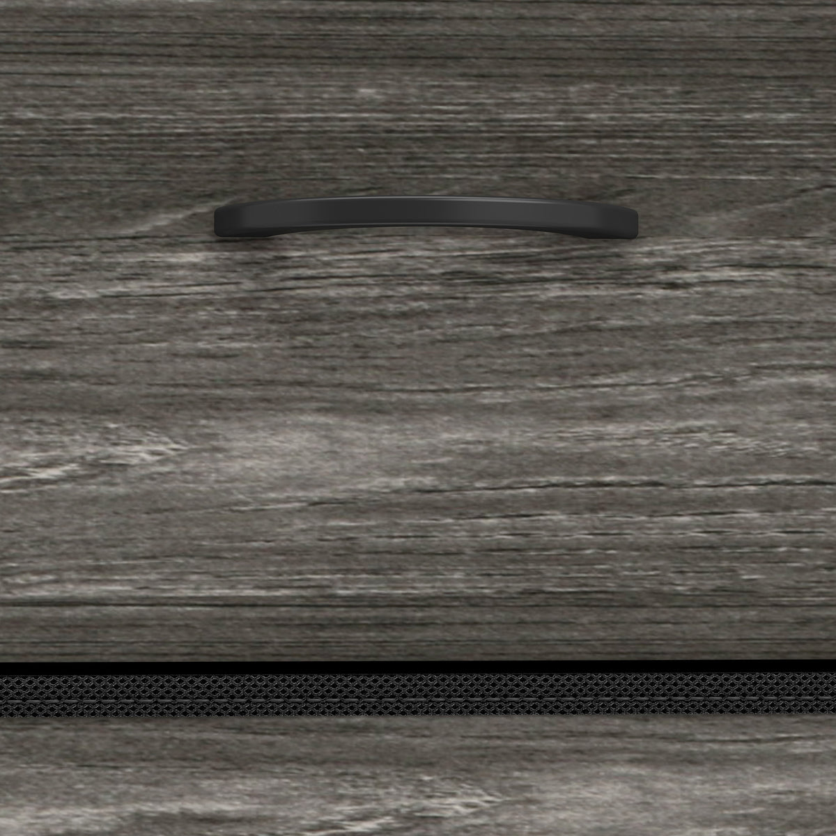 Close-up of grey wood-effect drawer front with curved black handle
