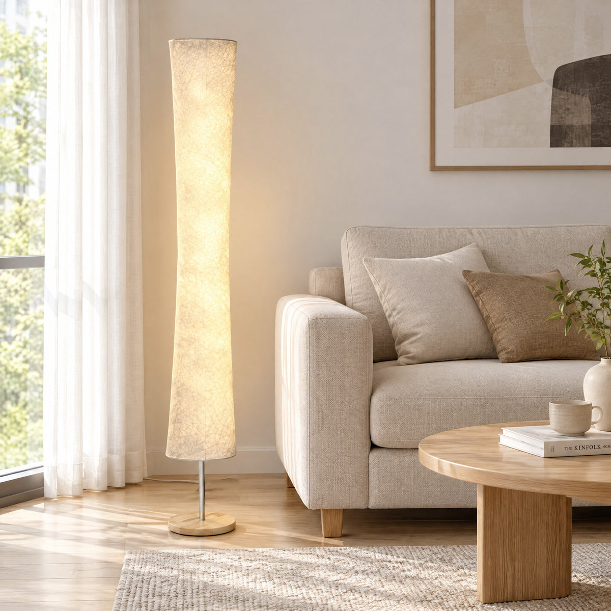 Tall floor lamp with textured paper shade and pine base