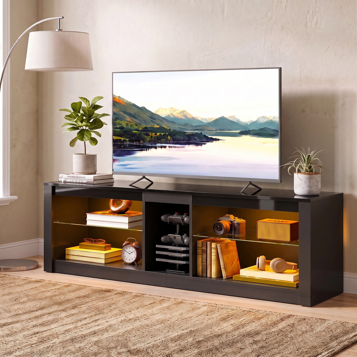 Dark gray TV stand with multiple open cubbies for electronics, books, and decor