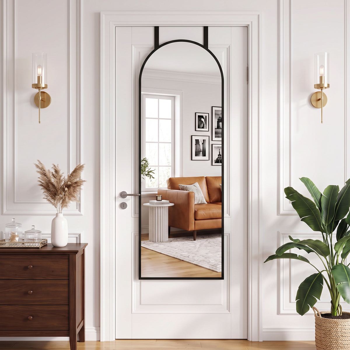 Arched full-length wall mirror with black frame and clear reflective glass
