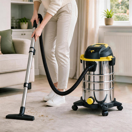 Wet and dry vacuum cleaner with stainless steel tank, black hose, and yellow accents