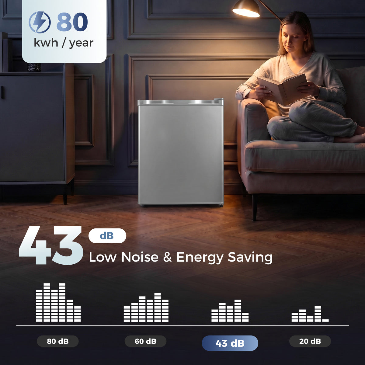 Grey mini fridge in a living room at night with low-noise energy-saving design