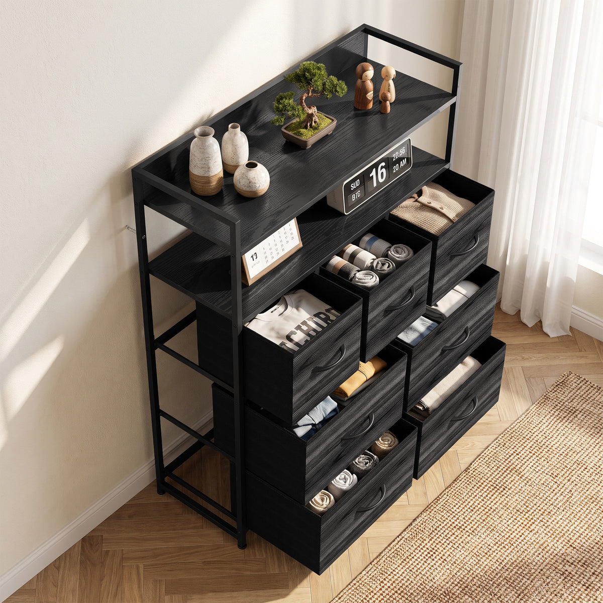 Black fabric dresser with open shelves and seven drawers, shown in angled view