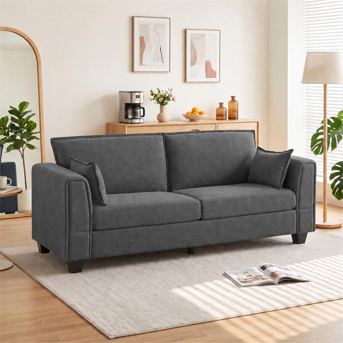 Dark grey 3-seater sofa with padded armrests and cushioned seat, linen-look upholstery.