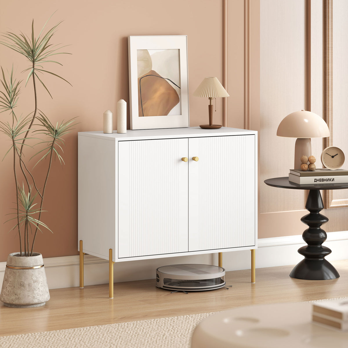 White sideboard cabinet with fluted doors, gold legs, and two knob pulls