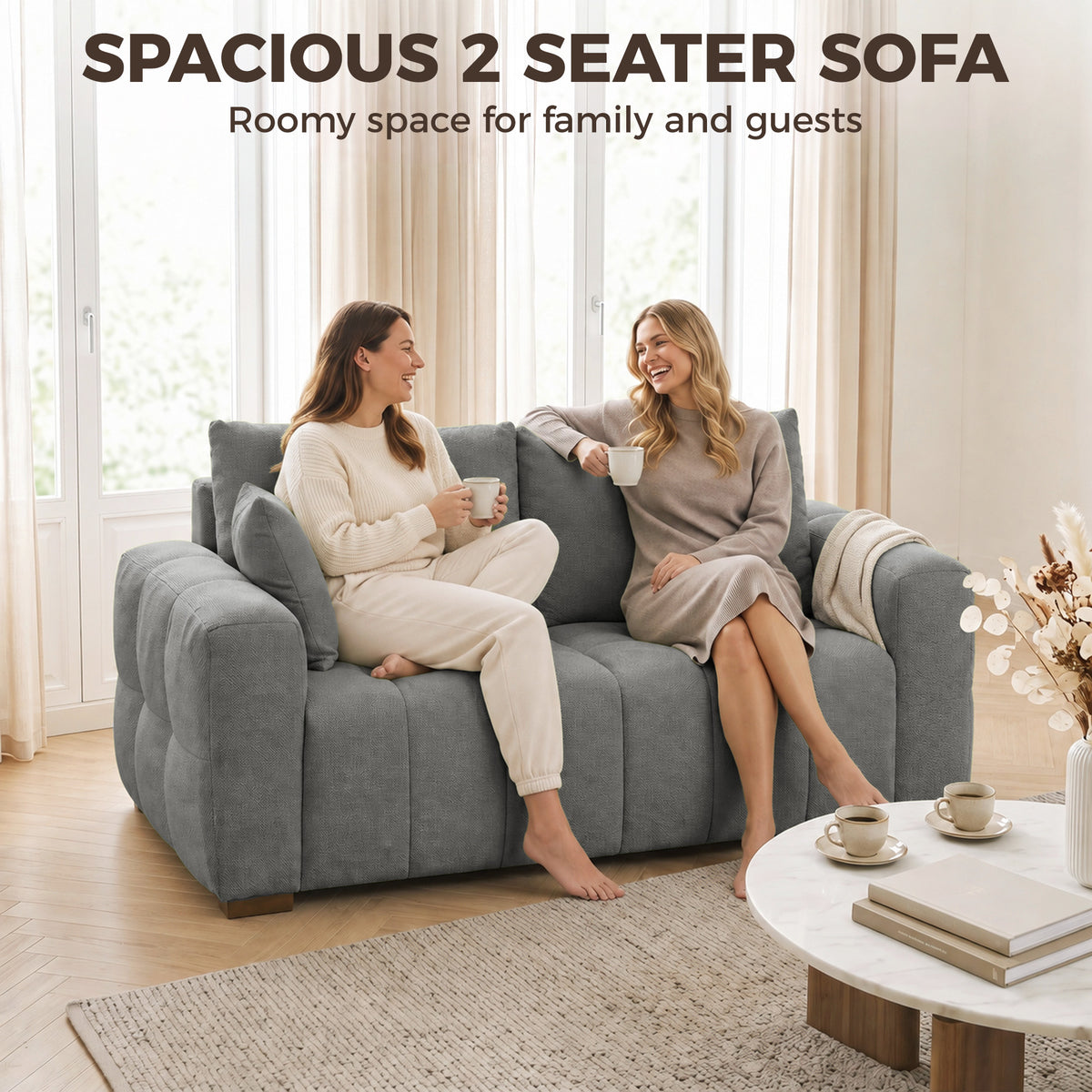 Grey velvet 2-seater sofa with two seat pillows and wide armrests.