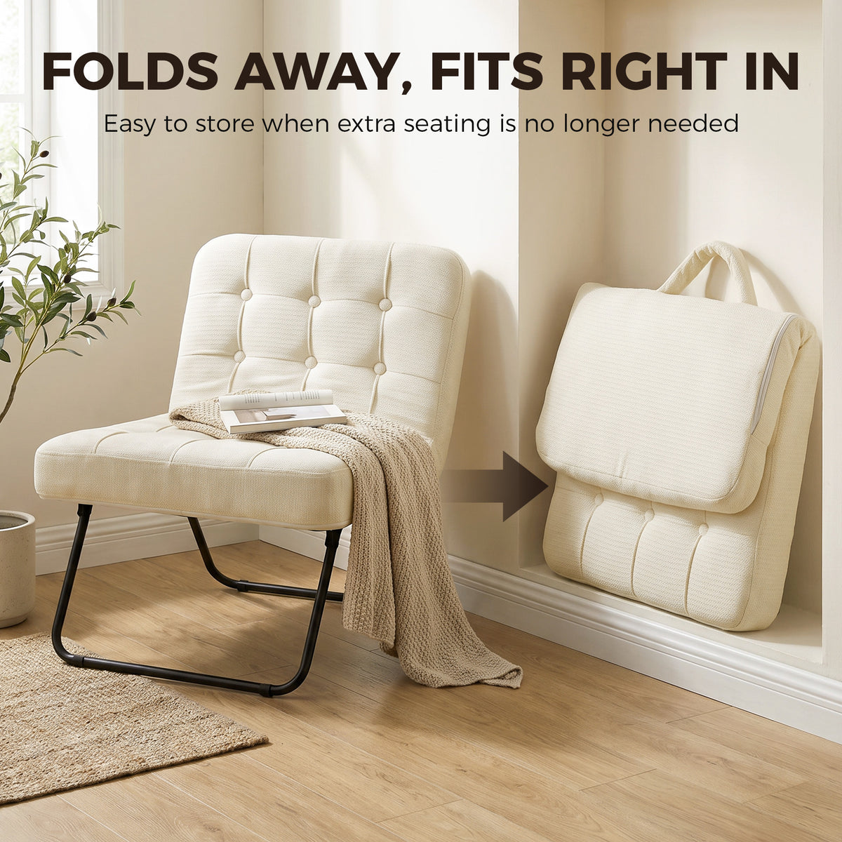Cream foldable lounge chair folded for storage, padded seat and tufted back, black frame.