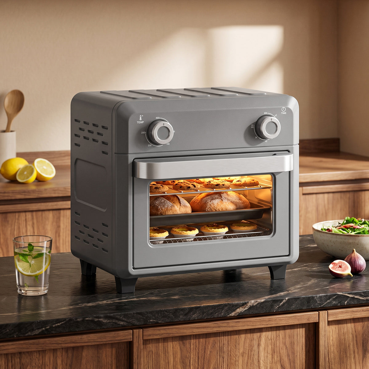 Grey air fryer oven with front glass window on countertop