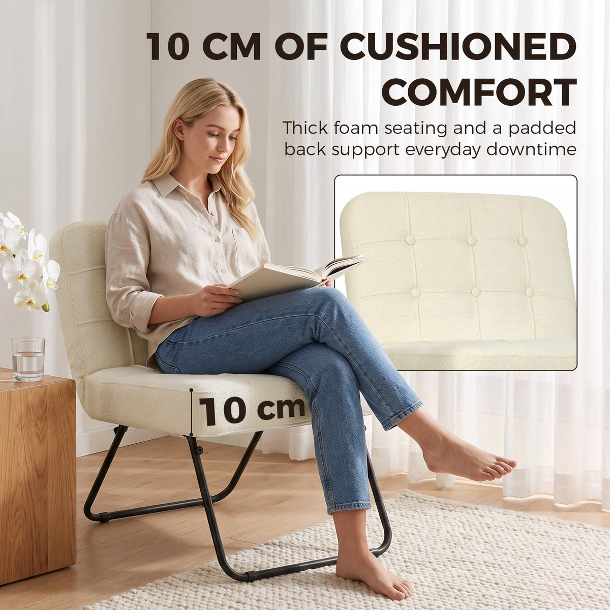 Cream lounge chair with thick cushioned seat and padded back support, black folding frame.