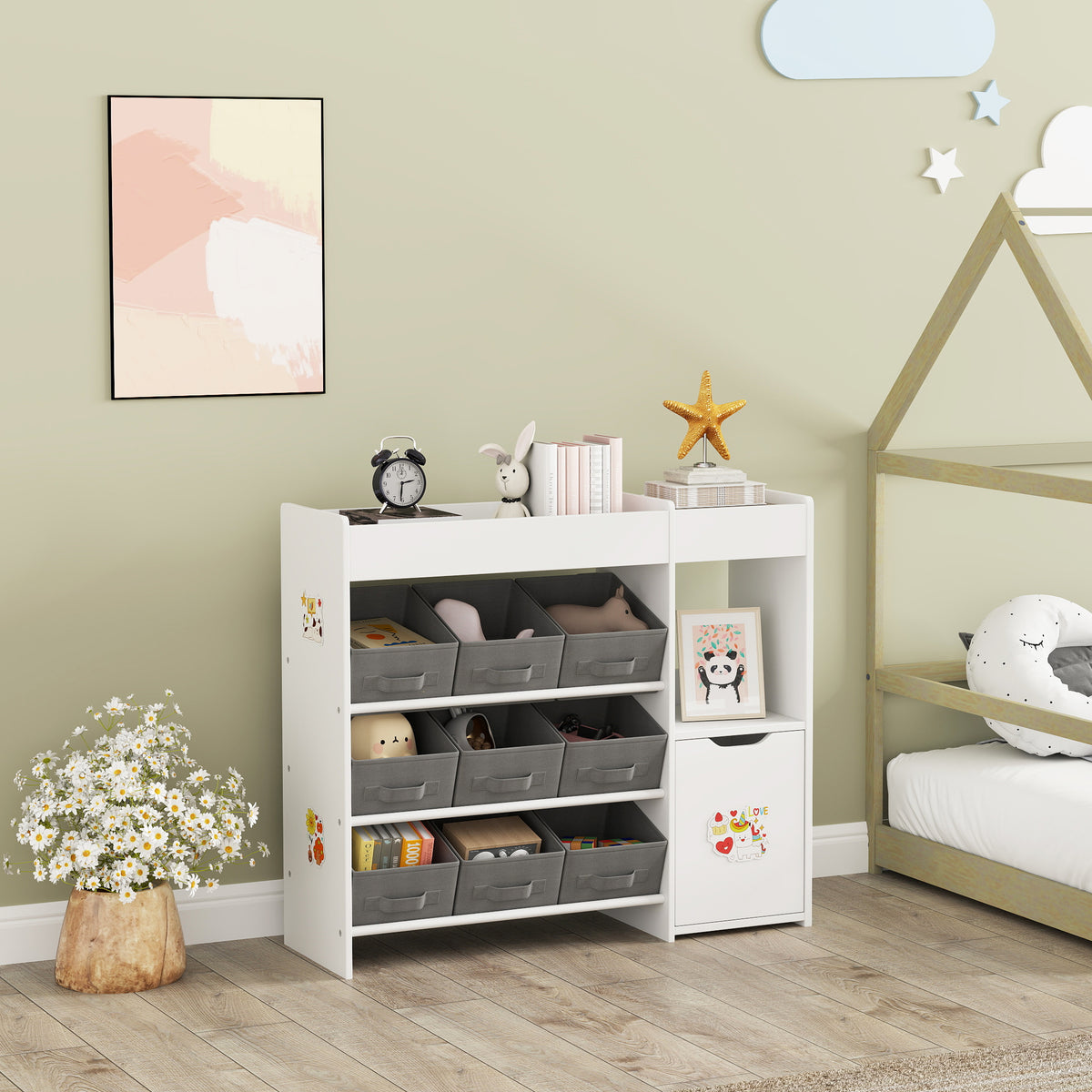 White kids toy storage organizer with open compartments, gray bins, and matching cabinet door