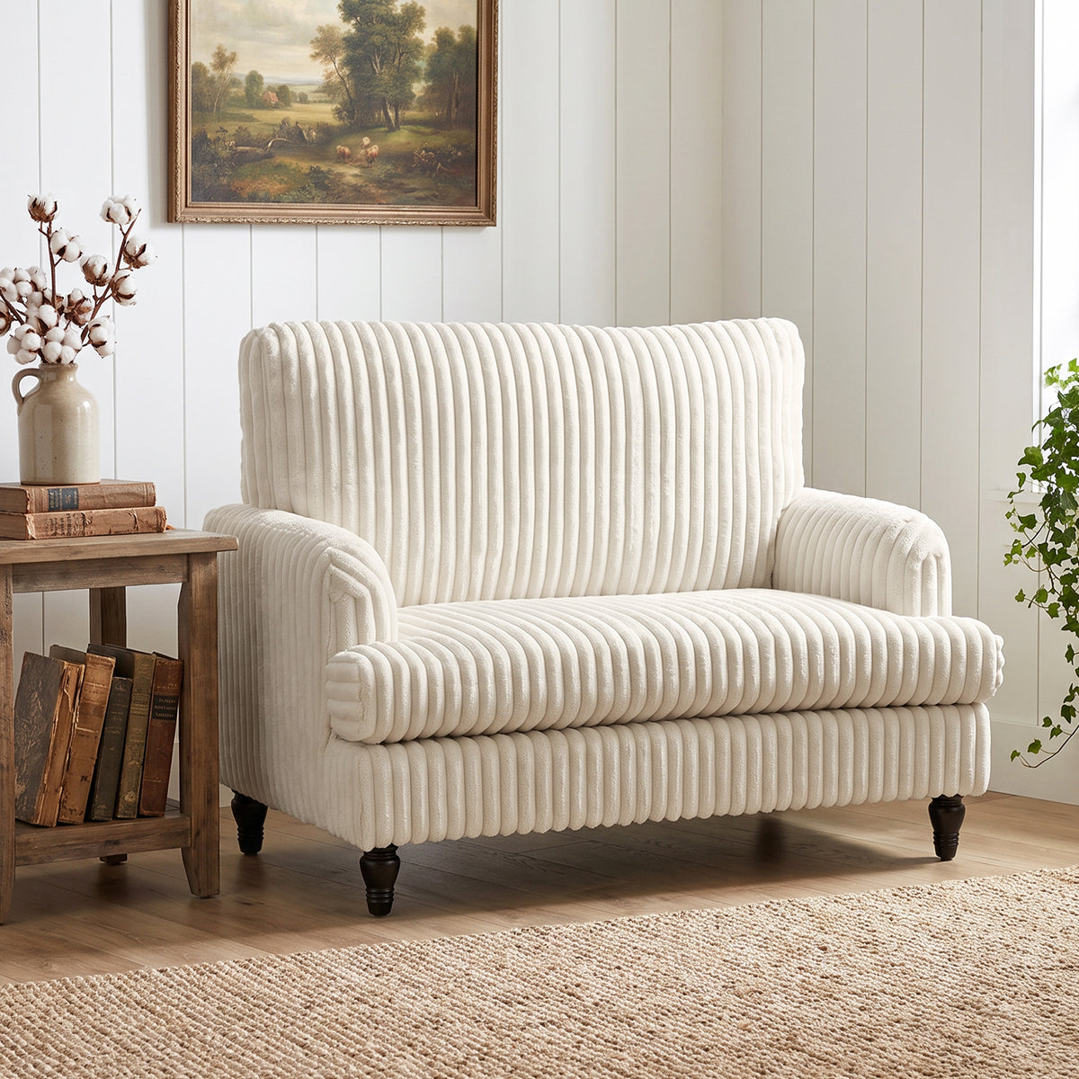 Cream corduroy single sofa armchair with wide padded seat, ribbed stripes, and rounded back