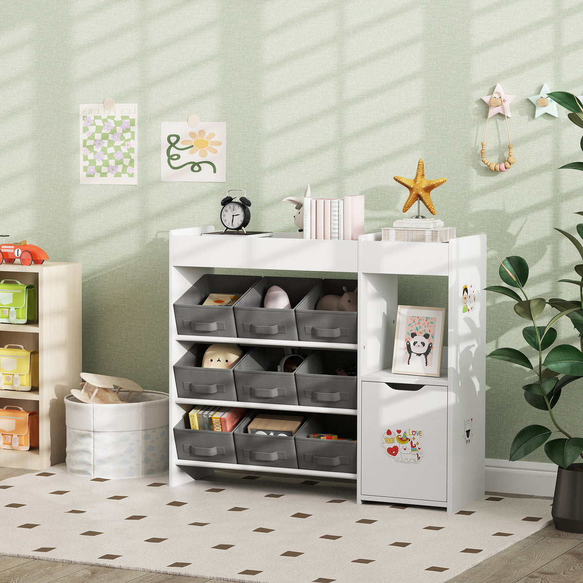 White kids toy storage organizer with open front shelves, gray bins, and decorative picture panels