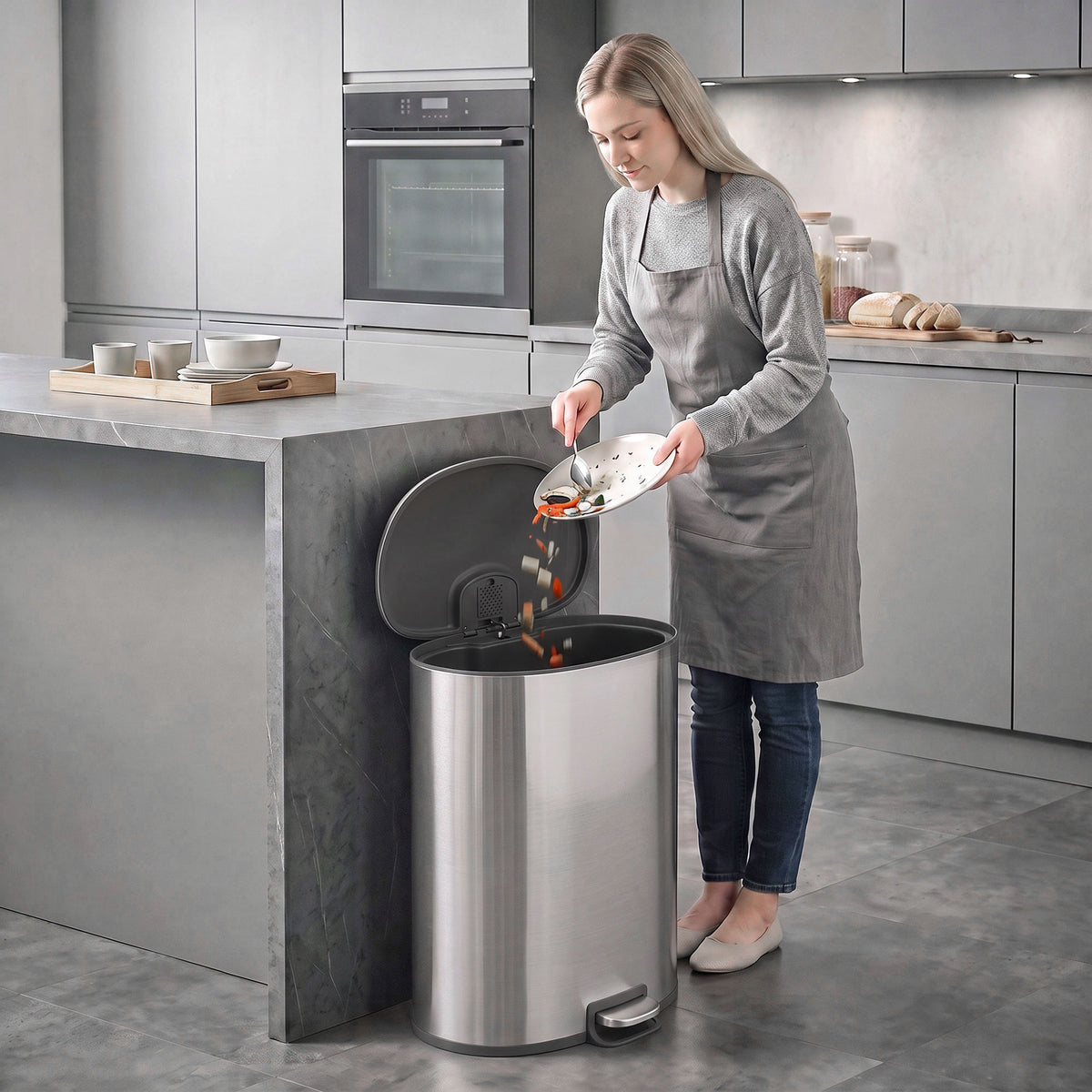 Stainless steel kitchen pedal bin with lid open and visible foot pedal base
