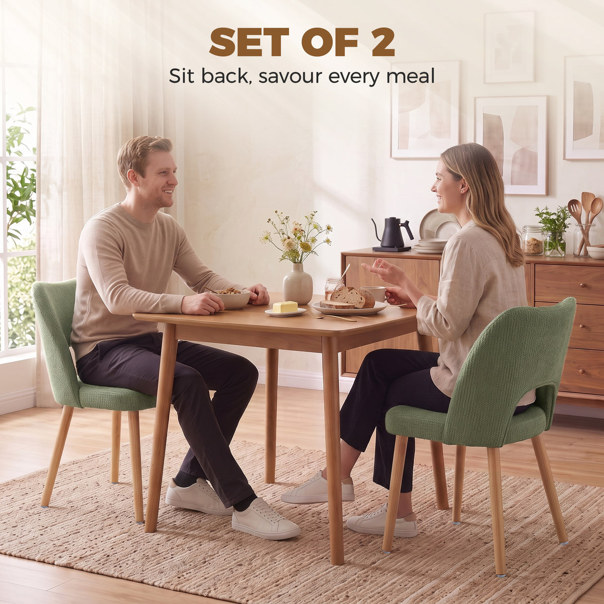 Set of 2 green chenille dining chairs with curved backs and light wood legs