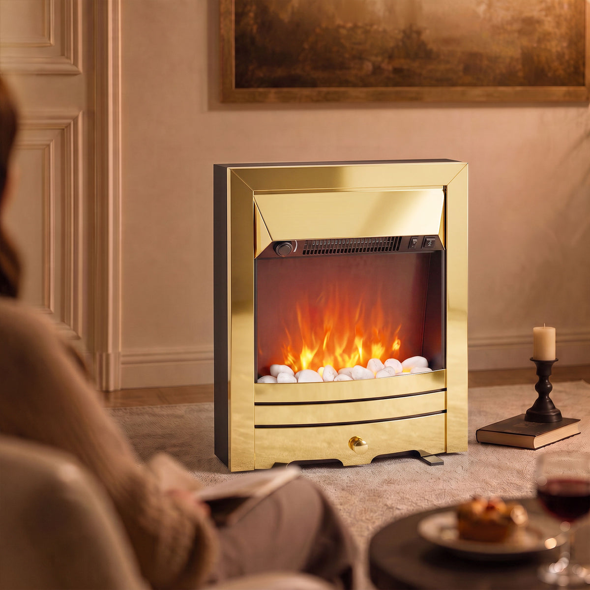 Gold-finish freestanding electric fireplace stove with glowing LED flame and lower shelf