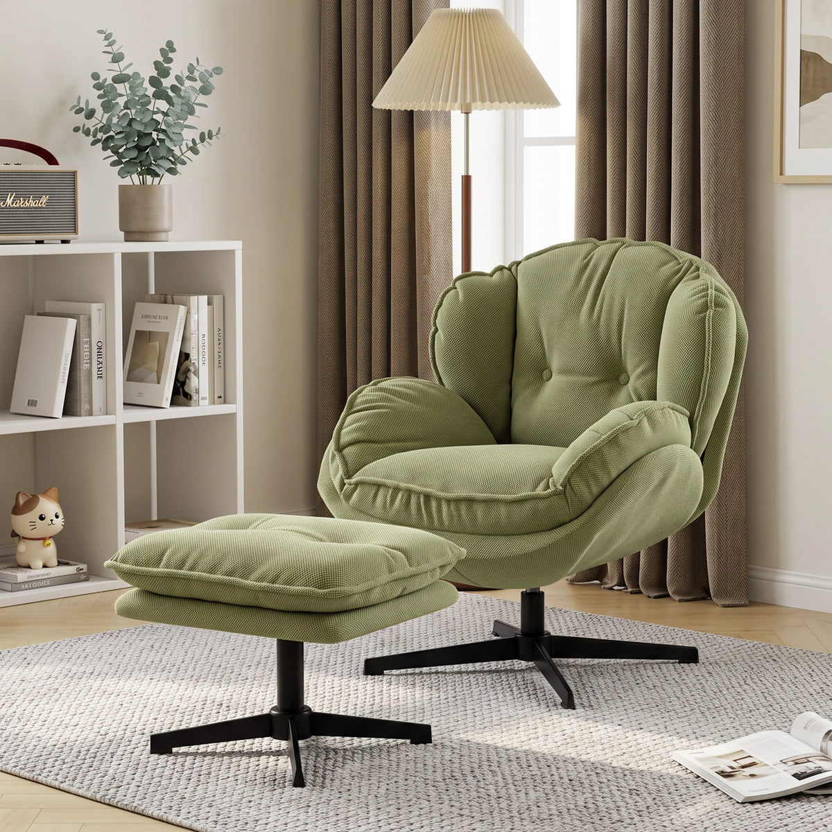 Green swivel armchair with matching footstool and black base, lounge seating
