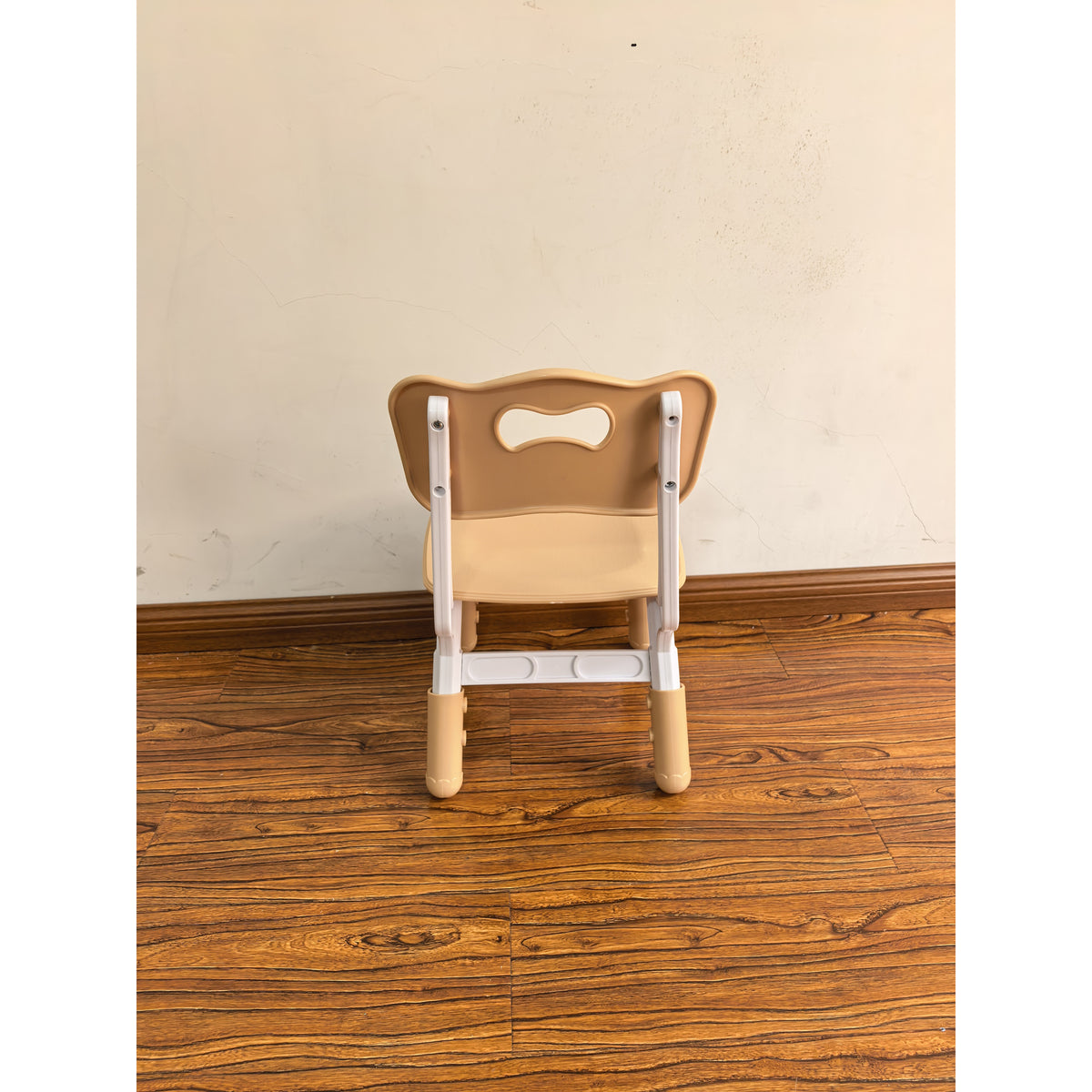 Adjustable kids desk chair, brown backrest with handle cutout, white frame and legs