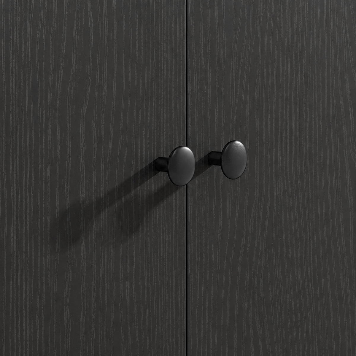 Dark kitchen island cabinet doors with two round knobs