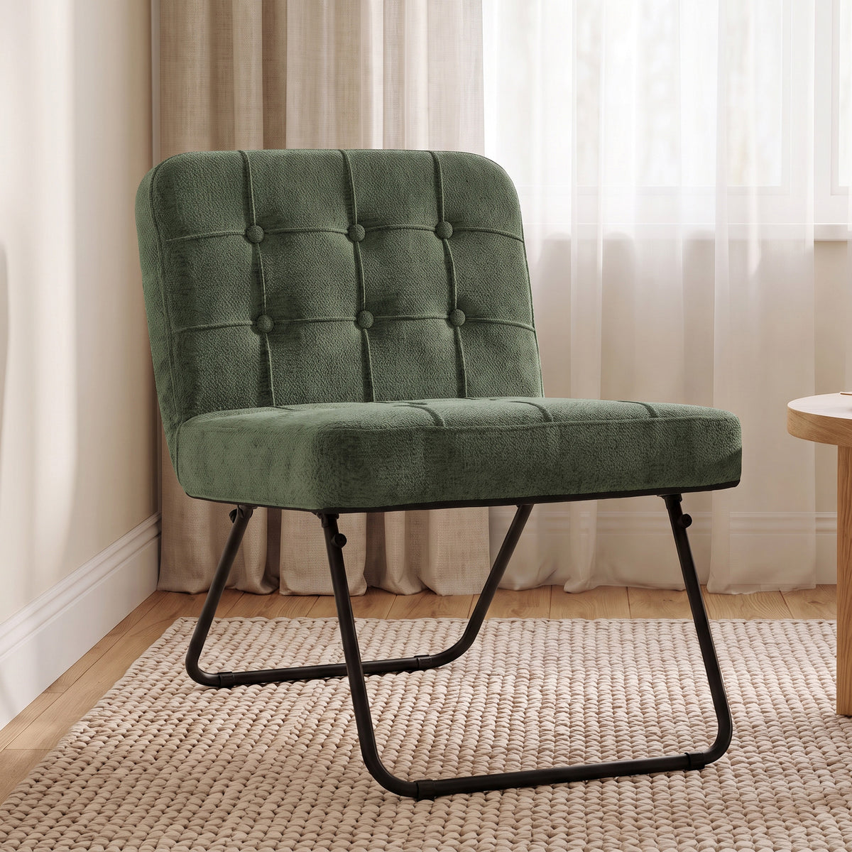 Upholstered dark green accent chair with button-tufted back, thick seat, and black metal legs
