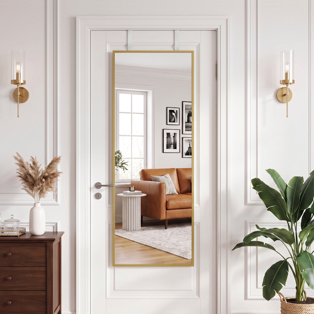 Full length mirror with gold-tone frame mounted on white panel door